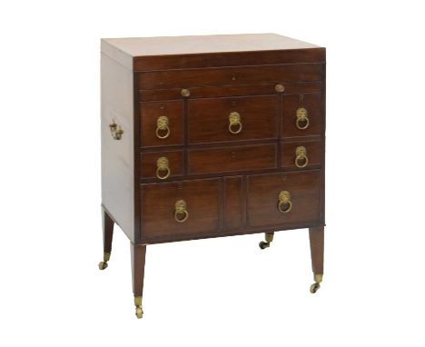 Late George III mahogany dressing cabinet and washstand, the hinged rectangular top enclosing an arrangement of lidded and ot