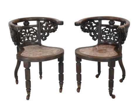 Pair of 19th Century Chinese carved hardwood chairs, each with bowback over dragon and scrollwork carving, the shaped seat wi