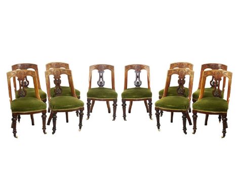 Set of ten Victorian walnut dining chairs, of 'Klismos' form, each with carved stylised decoration above overstuffed seat rai