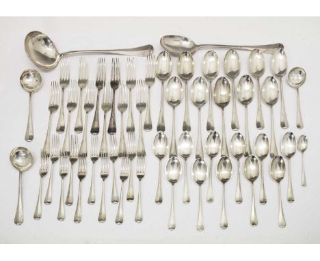 Matched suite of George V silver Hanoverian rat-tail cutlery comprising; eleven tablespoons and eleven dessert spoons, eleven