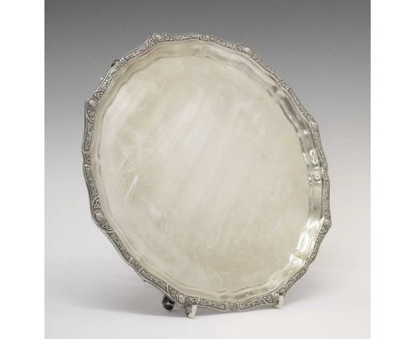 George VI pie-crust salver with celtic knot border and standing on three cast feet, sponsor's mark of Reid &amp; Sons, Birmin