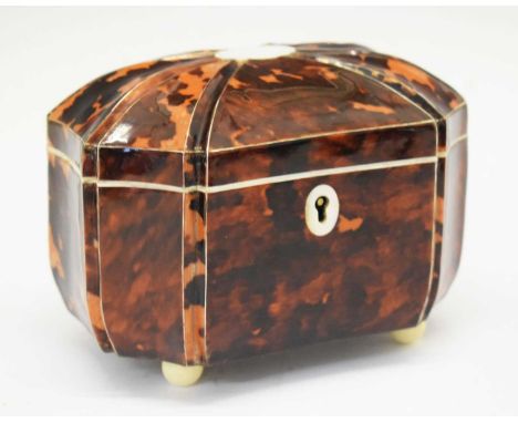 Early Victorian tortoiseshell tea caddy, of concave-sided octagonal form, the hinged domed cover, with eight moulded pewter-s