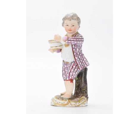 Late 19th Century Meissen model of a boy in striped jacket and breeches, on tree-stump mound base with rococo scroll surround