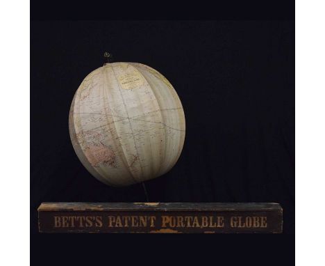 Victorian Betts's Patent Portable Globe, printed on silk over a black folding metal frame, 34cm diameter, with original woode