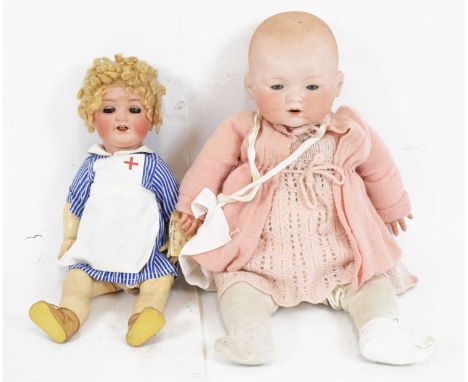 Two early 20th Century German bisque head dolls, comprising a Heubach Koppelsdorf example, with sleeping blue glass eyes and 