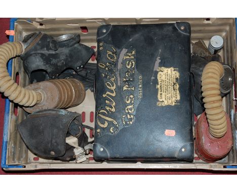 A WW II British Standard Service respirator, together with various other respirators, two Babies Protective helmets and a sur