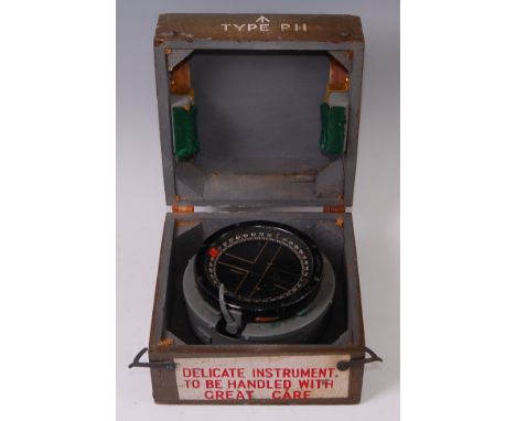 A WW II R.A.F. flying compass Type P11 No. 643/B/53, with War Department label 6B/1672, in fitted grey painted box of issue.