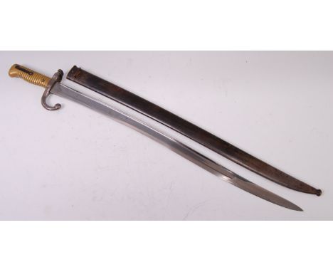 A French model 1866 Chassepot bayonet, having a 57cm singled edged fullered Yataghan shaped blade, hooked quillon and ribbed 