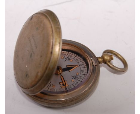 A WW I Dennison VI nickel cased compass, dated 1918, 4.5cm.