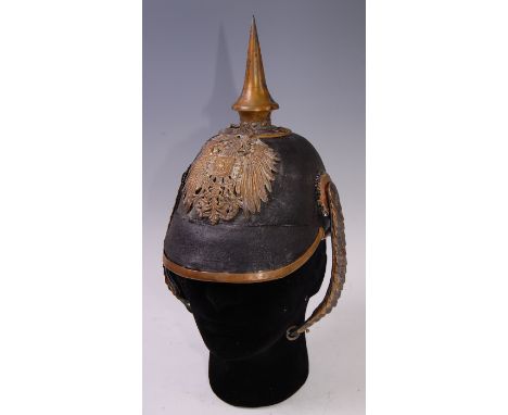 An Imperial German Officer's picklehaube, having a brass spike above Colonial? plate with leather liner and brass chin scales
