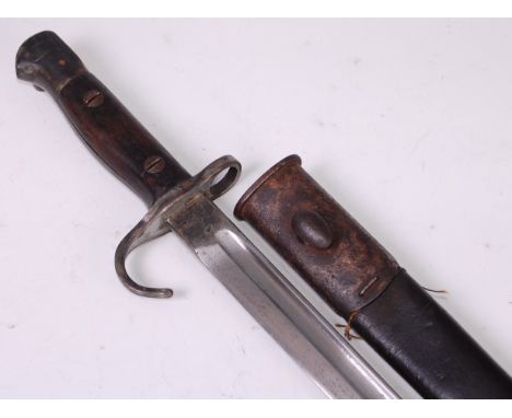 A British 1907 pattern bayonet, the 43cm fullered blade stamped to the ricasso with a crowned ER cypher 1907 Sanderson with v