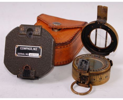 A WW II brass cased Mk III prismatic marching compass, stamped verso TG. Co Ltd, London, No.B 281684 and dated 1944, 8cm, tog