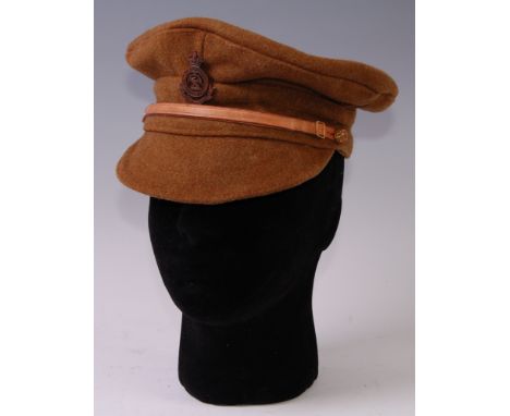 A British Army trench cap with Royal Bucks Hussars badge.