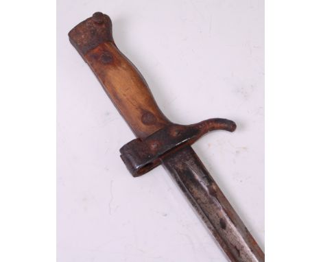 A French model 1892 bayonet, having a 40cm fullered blade and two piece grip with hole to the pommel, 51.5cm.