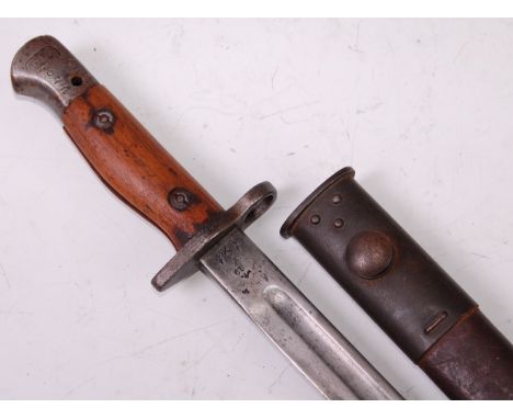 A British 1907 pattern bayonet, the 43cm single edged fullered blade stamped to the ricasso with a crowned GR cypher 1907 San