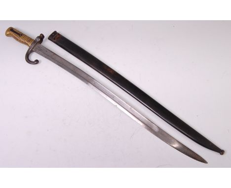 A French model 1866 Chassepot bayonet, having a 57cm singled edged fullered Yataghan shaped blade, stamped to the back edge M