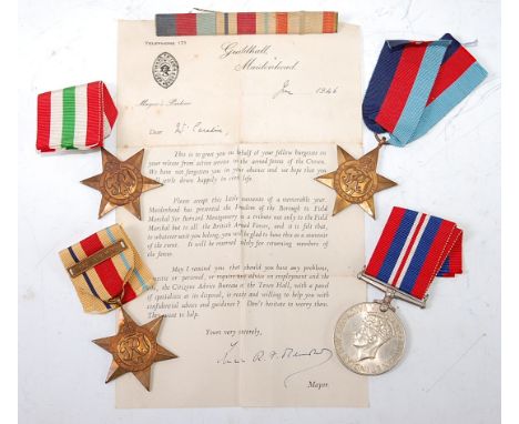 A WW II group of four to include 1939-45 Star, Africa Star with 1st Army clasp, Italy Star and War medal, together with a typ