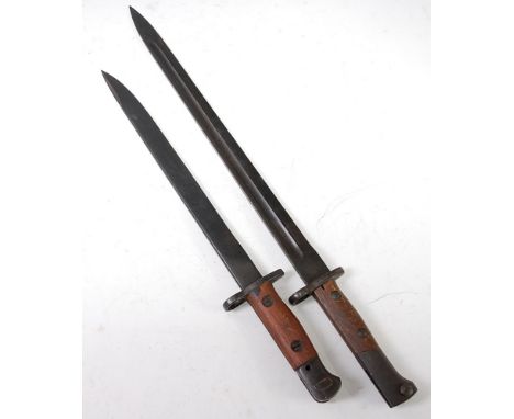 A Czechoslovakian model 33/40 mauser bayonet, having a 38.5cm blued steel fullered blade and walnut two piece grip, 52cm, tog