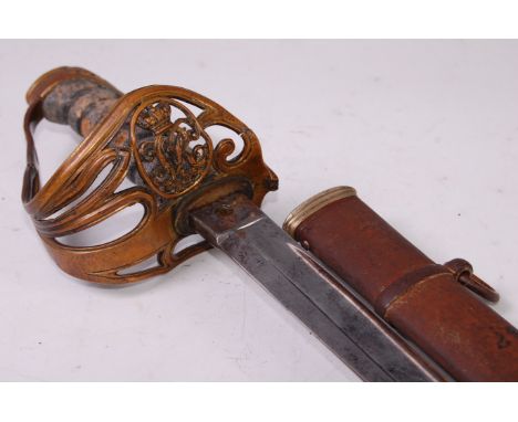 An 1854 pattern Infantry sword, the 83cm fullered blade etched with a crowned cypher and foliage, stamped to the forte Hawkes