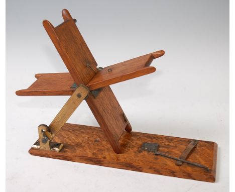 A Hardy Bros. 1911 model oak and brass mounted table top line drier,stamped to the brass arm Hardy Bros. Ltd, Alnwick, Englan