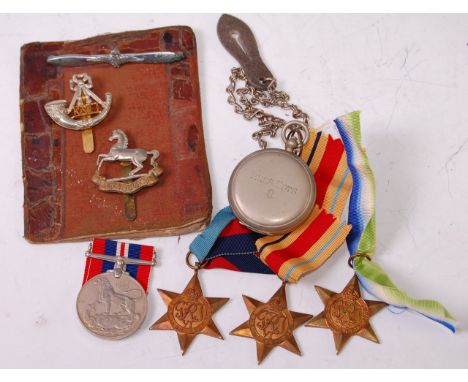 A group of four WW II medals to include 1939-45 Star, Africa Star, Atlantic Star and War, together with a nickel cased pocket