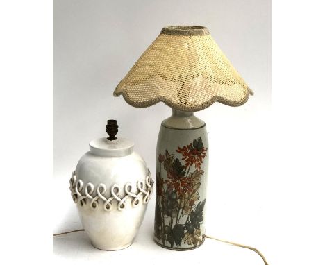 A tall studio pottery table lamp decorated with flowers, 55cmH to top of shade; together with a further French ceramic table 