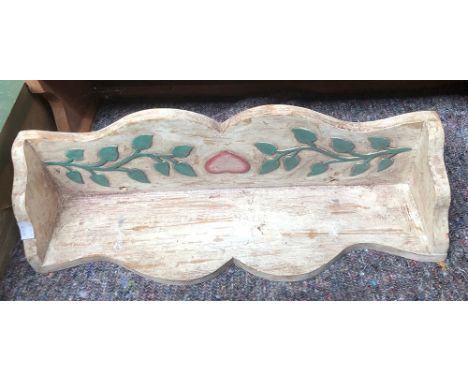 A carved and painted wall shelf, 53cmW 
