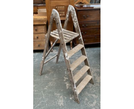 A vintage wooden folding stepladder 