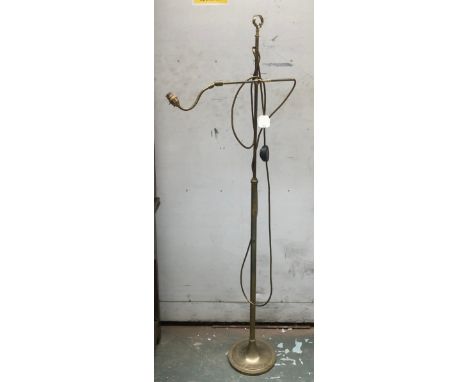 A gilt metal adjustable standard lamp, with balljoint fitting, 153cmH 