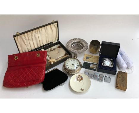 A mixed lot to include cased silver dressing table set (af); plated ware; four Zippo lighters; oversized Quartz desk clock; c