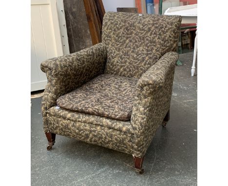 A good late Victorian small armchair, upholstered in an oak leaf print, on square tapered front legs, back leg number stamped