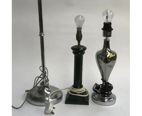 A chromed smoked glass table lamp, 34cmH to base of fitting; a chrome standard lamp 110cmH; and one other green lamp (3) 