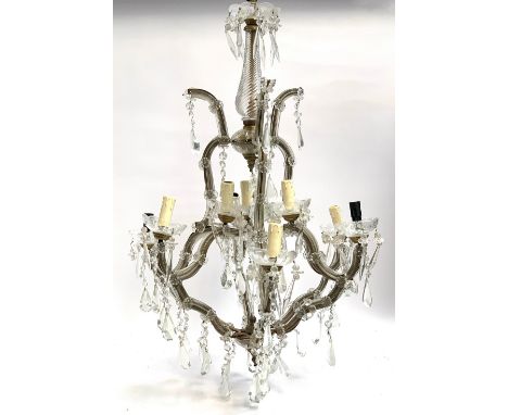 A large glass and wrought iron nine light fitting chandelier with cut glass drops, 80cm high 