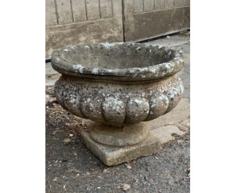 A composite stone garden urn planter, 39cmD, 30cmH 