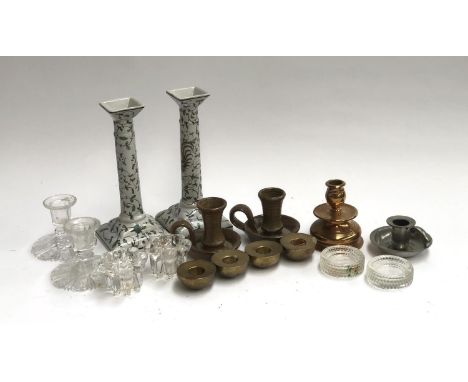 A small lot of various candle sticks, to include studio pottery chamber sticks; four brass candleholders; a pair of Portugues