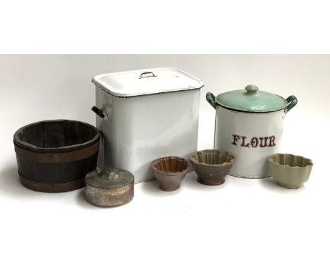 A rectangular enamel bread bin, 31cmH; a further enamel flour bin; three ceramic terrine moulds; a planter of staved construc