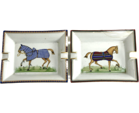 A pair of Hermes Paris rectangular ceramic ash trays, each depicting a horse within a guilt order. 19cm x 15.5cm (one repaire