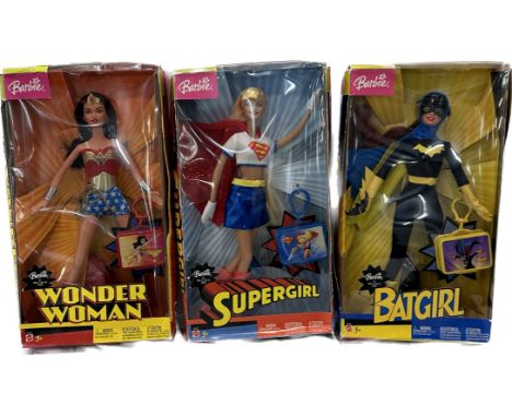 Three original boxed Barbie Super Heroes to include ' Supergirl', ' Batgirl' and ' Wonder Woman'