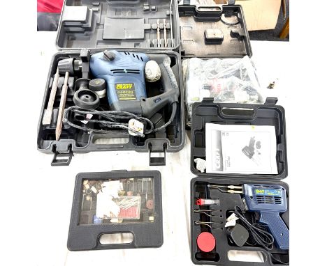Selection of cased tools to include a Powercraft hammer drill, Powercraft electric soldering set, tool accessories and a Powe