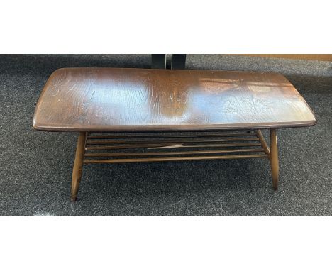 Ercol coffee table measures approximately 41 inches long x 18 wide and 14 tall- broken spindal