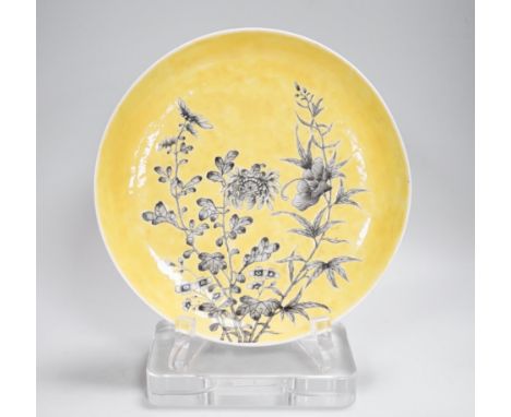 A Chinese grisaille enamel yellow ground dish, Guangxu mark and possibly of the period (1875-1908), 24cm in diameter Provenan