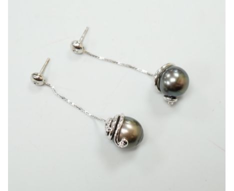 A modern pair of 750 white metal and diamond set cultured black pearl drop earrings, approx. 45mm, gross weight 16.1 grams.