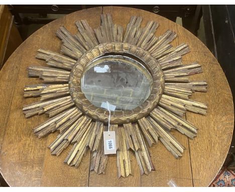 A vintage carved wood sunburst wall mirror, diameter 62cm