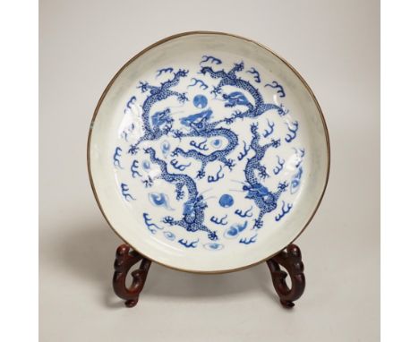 A 19th century Chinese blue and white ‘dragon’ dish and stand 18.5cm diameter Provenance - the vendor lived in Hong Kong in t