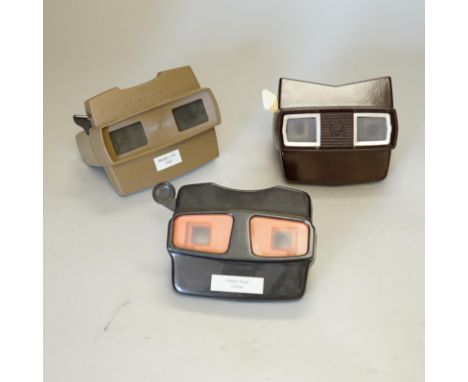 A collection of 21 View-Master viewers, including various models, a View-Master Projector and a large quantity of View-Master