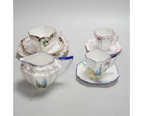 Seven Shelley Art Deco cups and saucers, three trios and a milk jug, some with Art Deco designs, largest 13cm wide