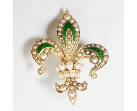 An early 20th century enamelled and pearl set gold fleur de lys brooch, the reverse with pin and suspension loop, 2.75cm., gr