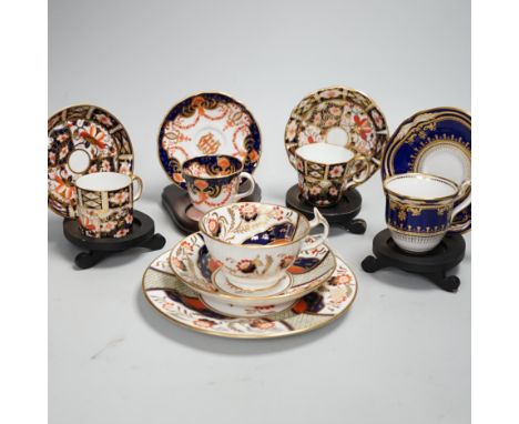 Three pairs of Royal Crown Derby porcelain cups and saucers, another Spode and a Victorian trio