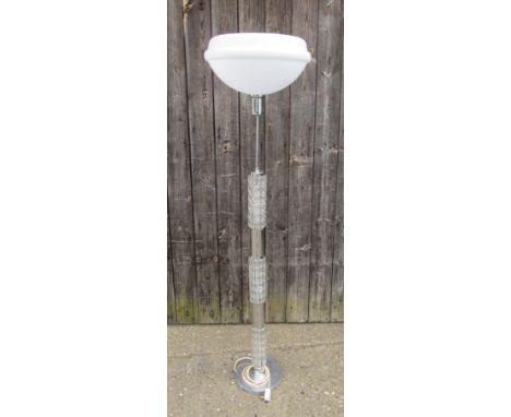A chromed metal and glass, standard lamp with illuminating stem 