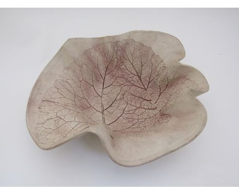 A large ceramic bowl of waved form with skeletal leaf pattern by Marianne Sundberg, Sweden 